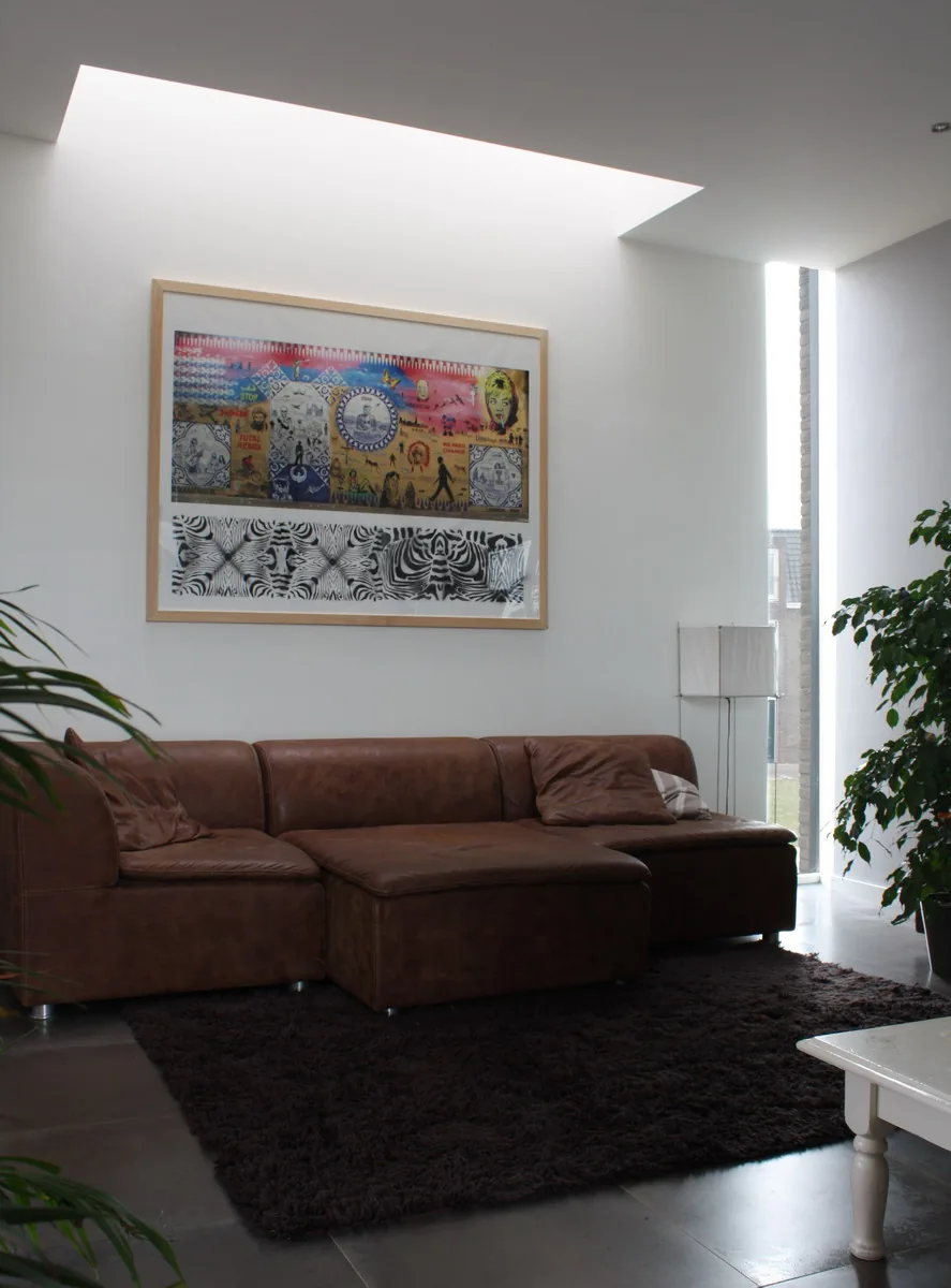 Transparante entreehal met zichtlijn van straat naar tuin